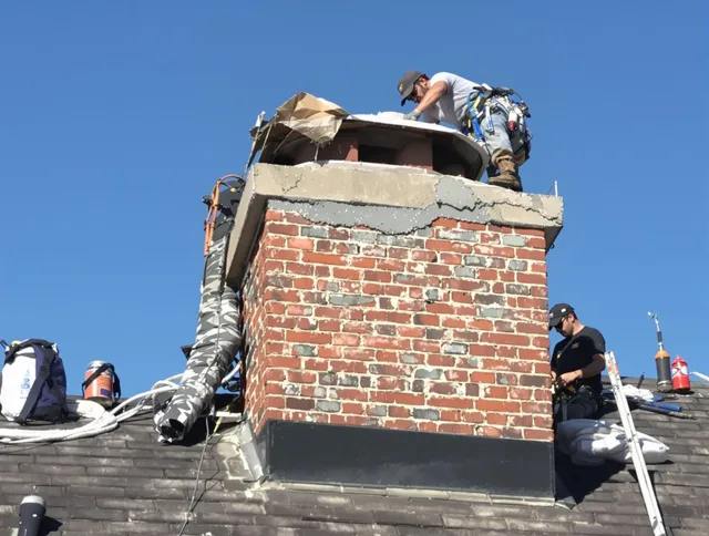 Orange Chimney Sweep installing a custom chimney crown in Orange, CA