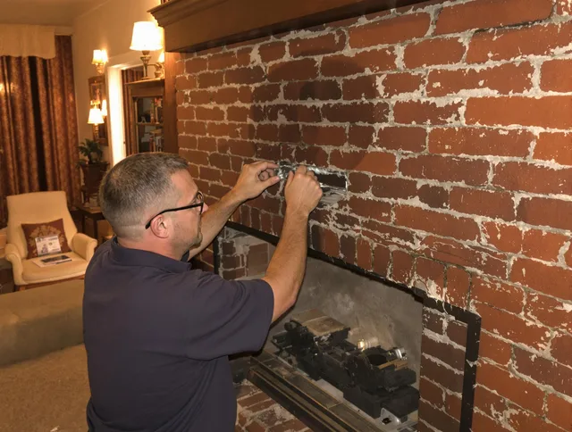 Orange Chimney Sweep expert fixing a fireplace in Orange, CA